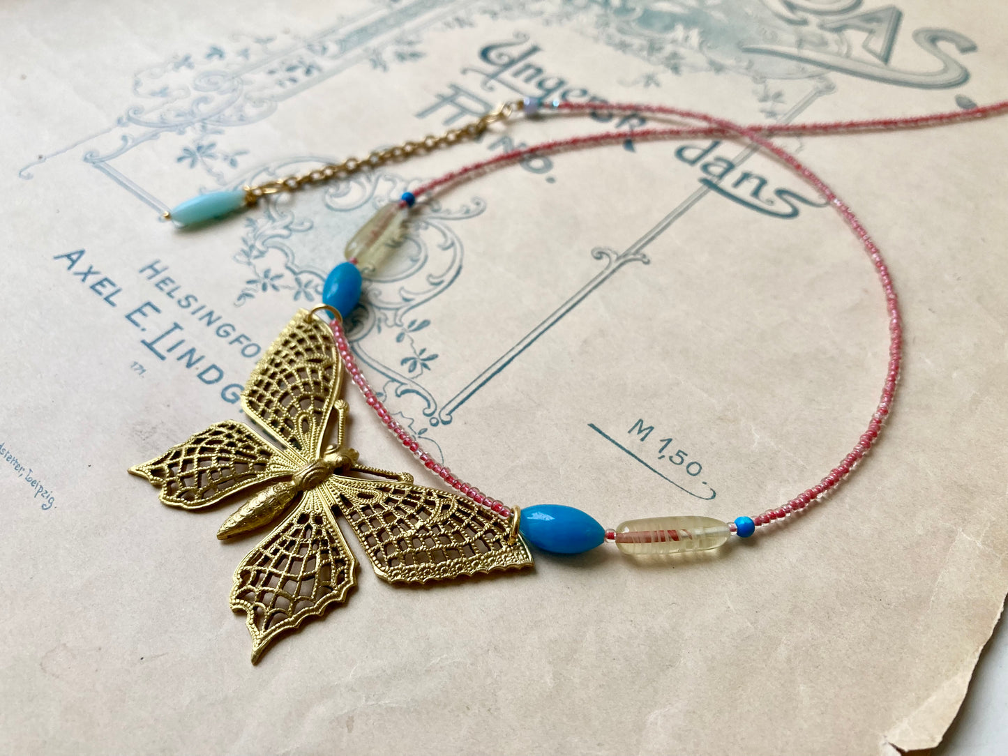 Papillon necklace in turquoise + red