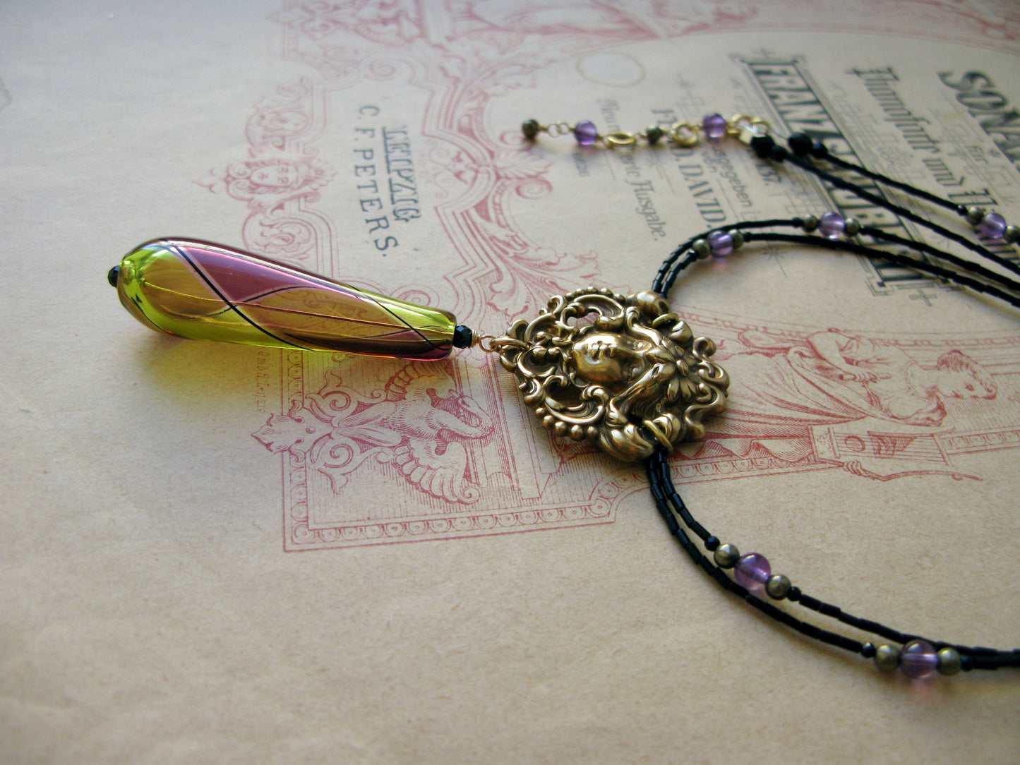 Arlecchino necklace Mascaron olive/plum