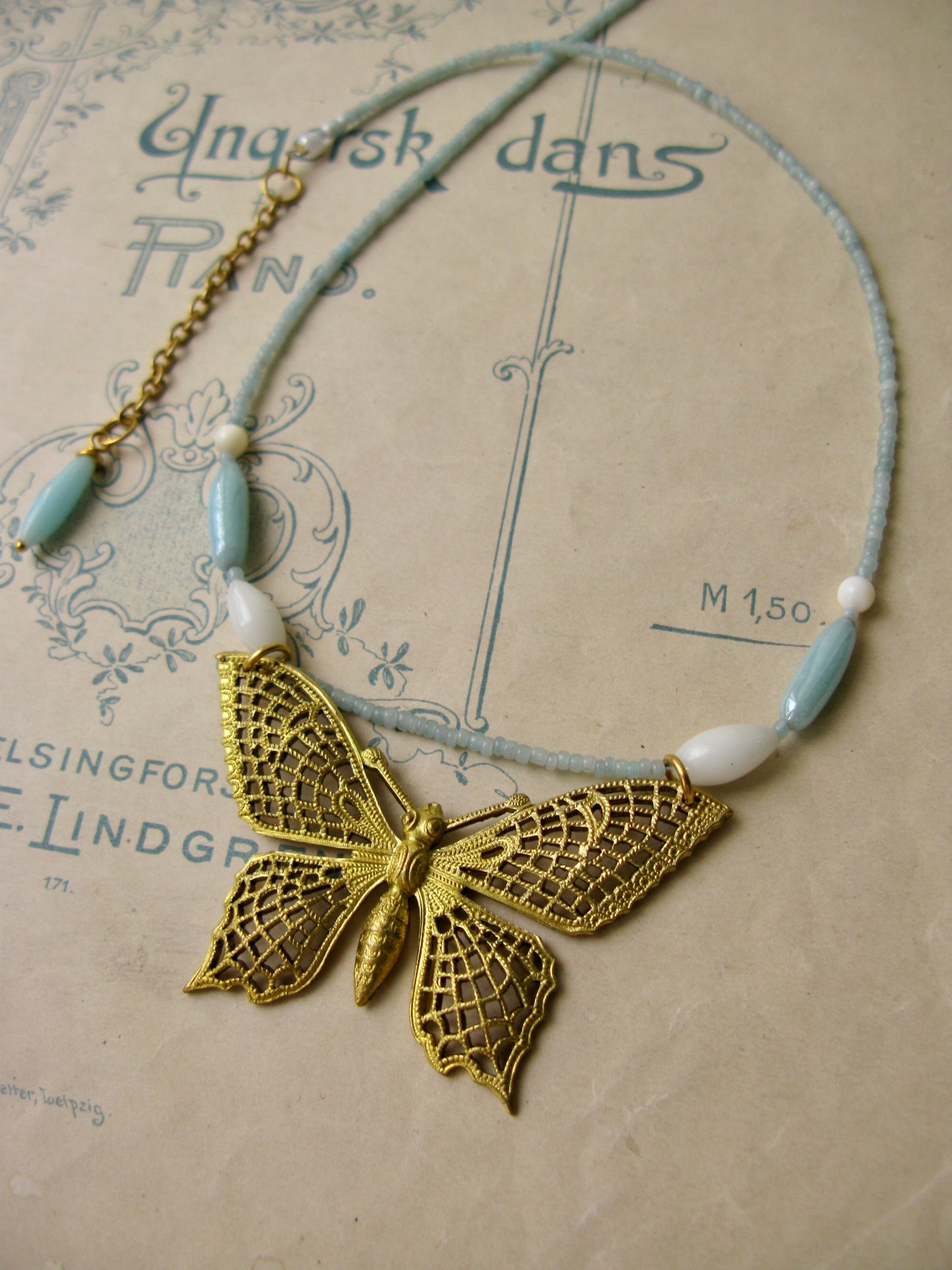 Papillon necklace in aqua + white