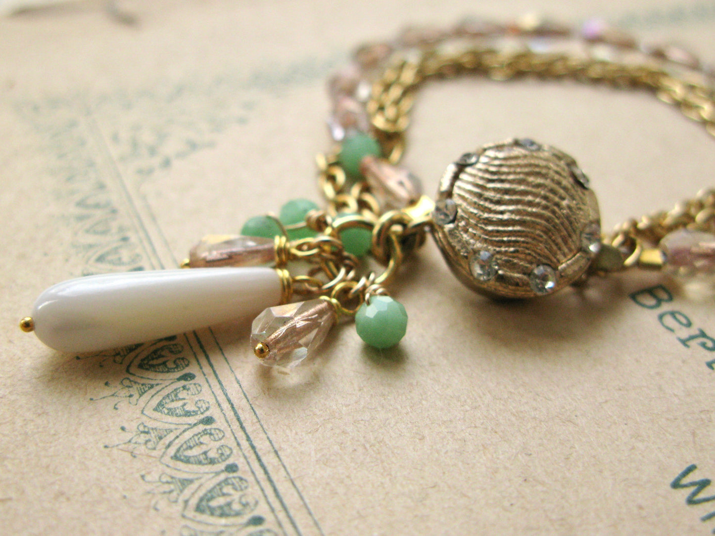 Closeup detail of a bracelet with beaded charms.