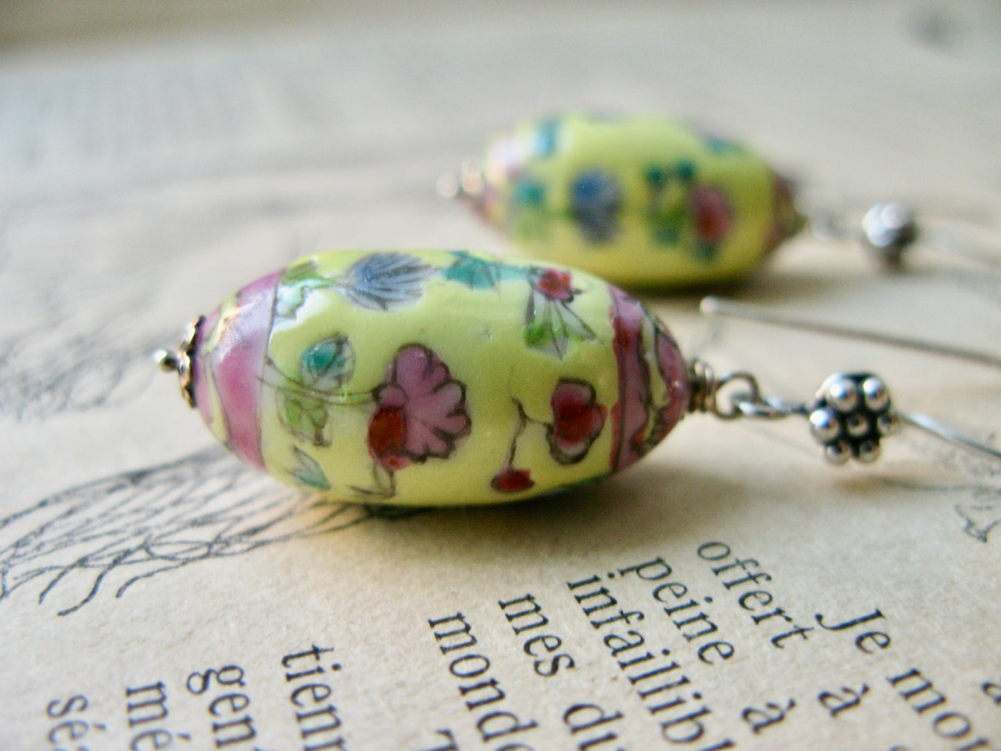 Closeup of colourful porcelain bead earrings