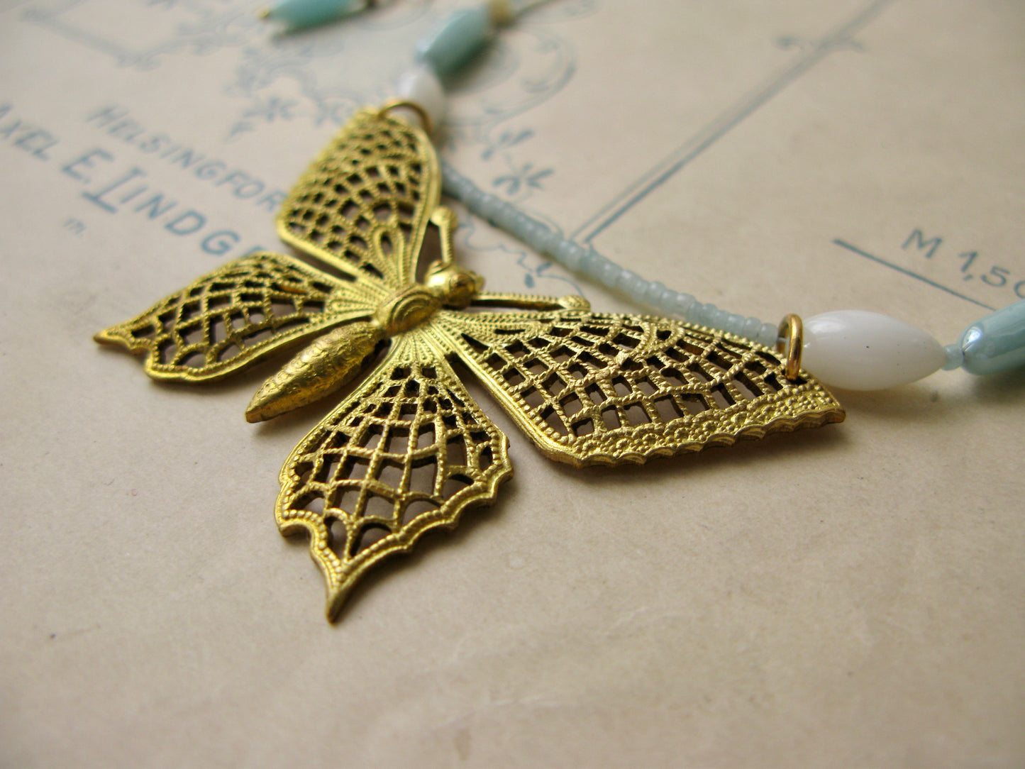 Papillon necklace in aqua + white
