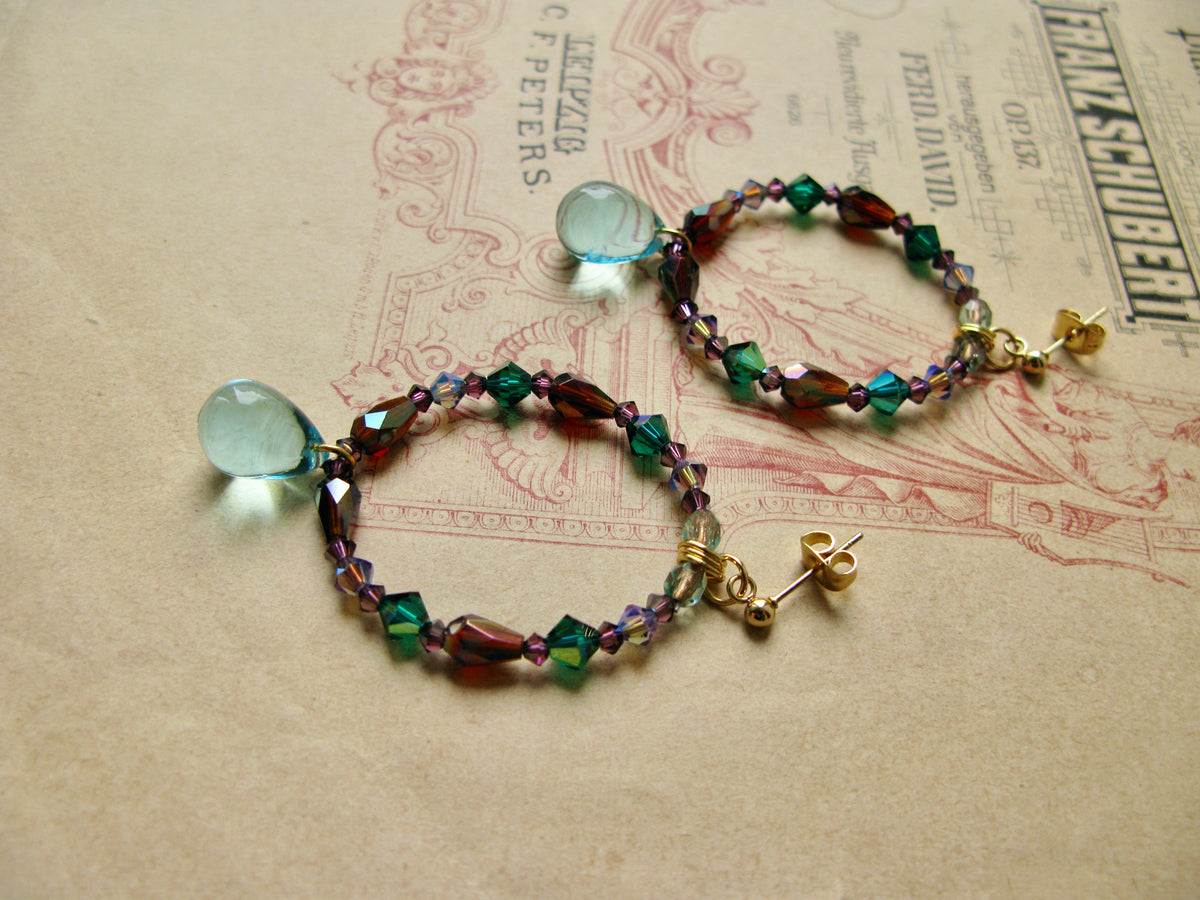 Suits large hoop earrings